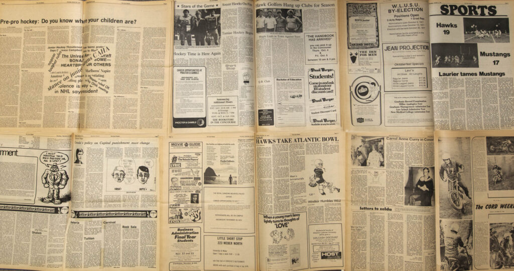 A collage of The Cord archival newspapers laid out on a table, featuring stories about sports and campus politics.